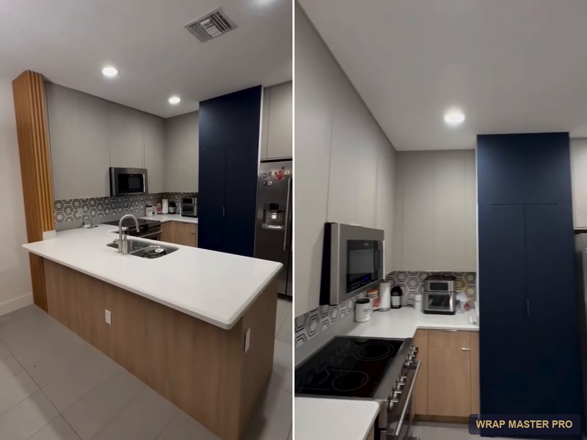 Navy acrylic pantry wall framed by light gray and woodgrain cabinets, South Florida
