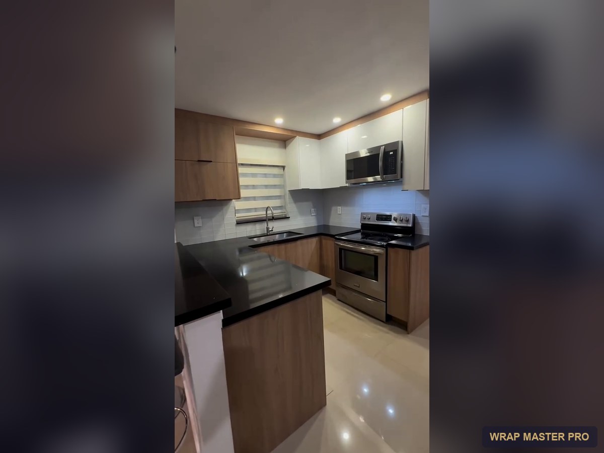 Two-tone kitchen with white high-gloss uppers and woodgrain lowers, South Florida