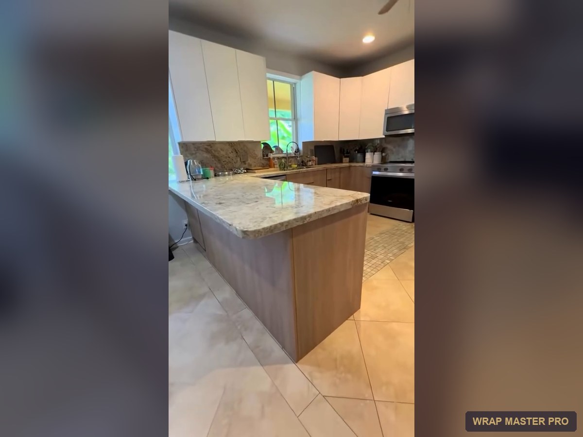Kitchen with white flat uppers and oak-look lowers over existing granite, South Florida