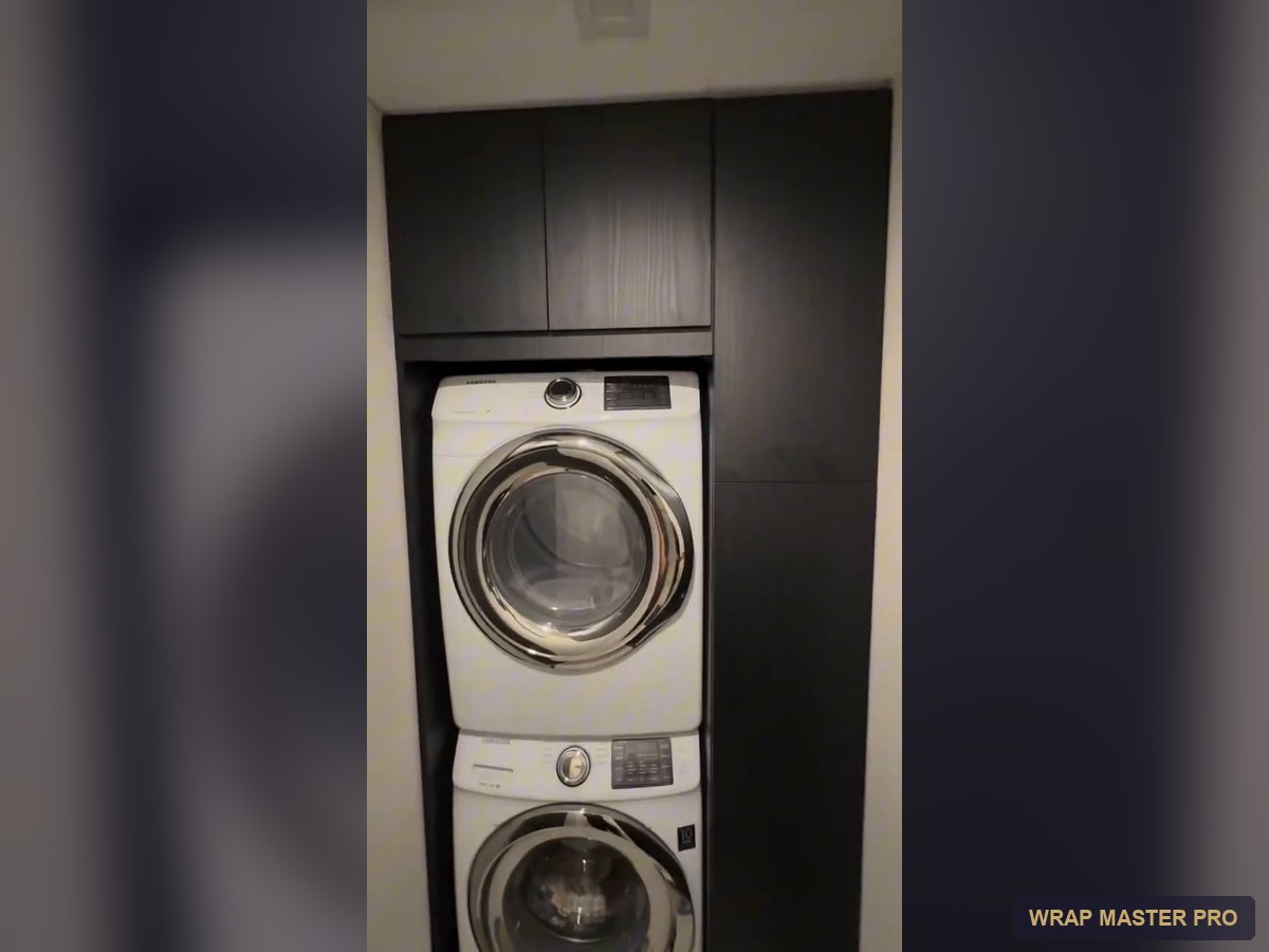 Built-in laundry closet with dark woodgrain cabinets, South Florida